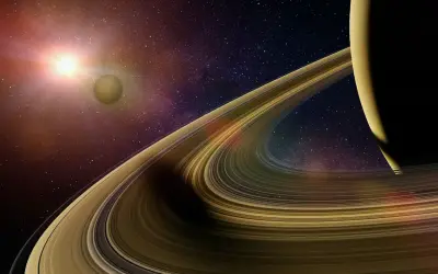 Saturnus ringar glittrar i solljuset, en måne svävar i bakgrunden bland stjärnorna.