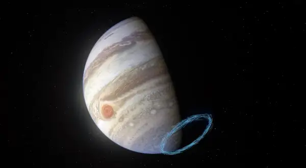 Jupiter genom teleskop, med den stora röda fläcken och en blåaktig virvel av energi.