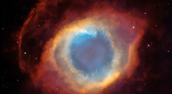 Enormt kosmiskt öga av gas och stoft, en **veil nebula** som lyser i blått, gult och rött.