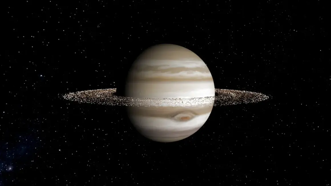 En gasjätte med band av moln och tunna, glittrande jupiter ringar mot en stjärnklar bakgrund.
