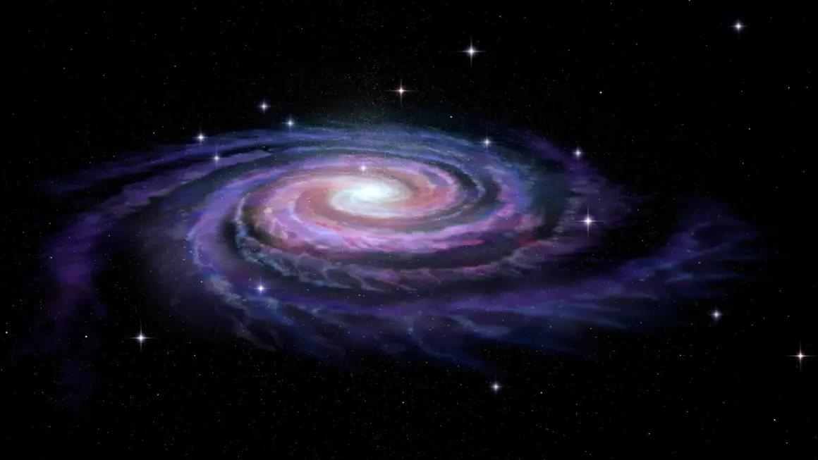 En spiralgalax med lysande armar av stjärnor och gas, som visar vad som består en galax av.