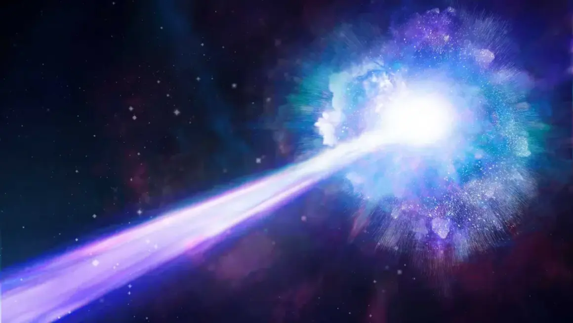 En stråle av laddade partiklar skjuter ut från en ljus, blå och lila nebulosa i rymden.