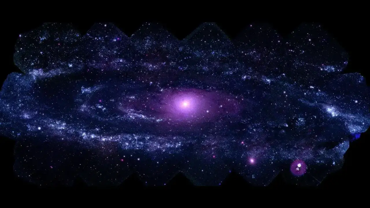 En virvlande galax i lila och bl&aring;tt, omgiven av stj&auml;rnor. Bilden v&auml;cker fr&aring;gan: hur m&aring;nga galaxer finns det?