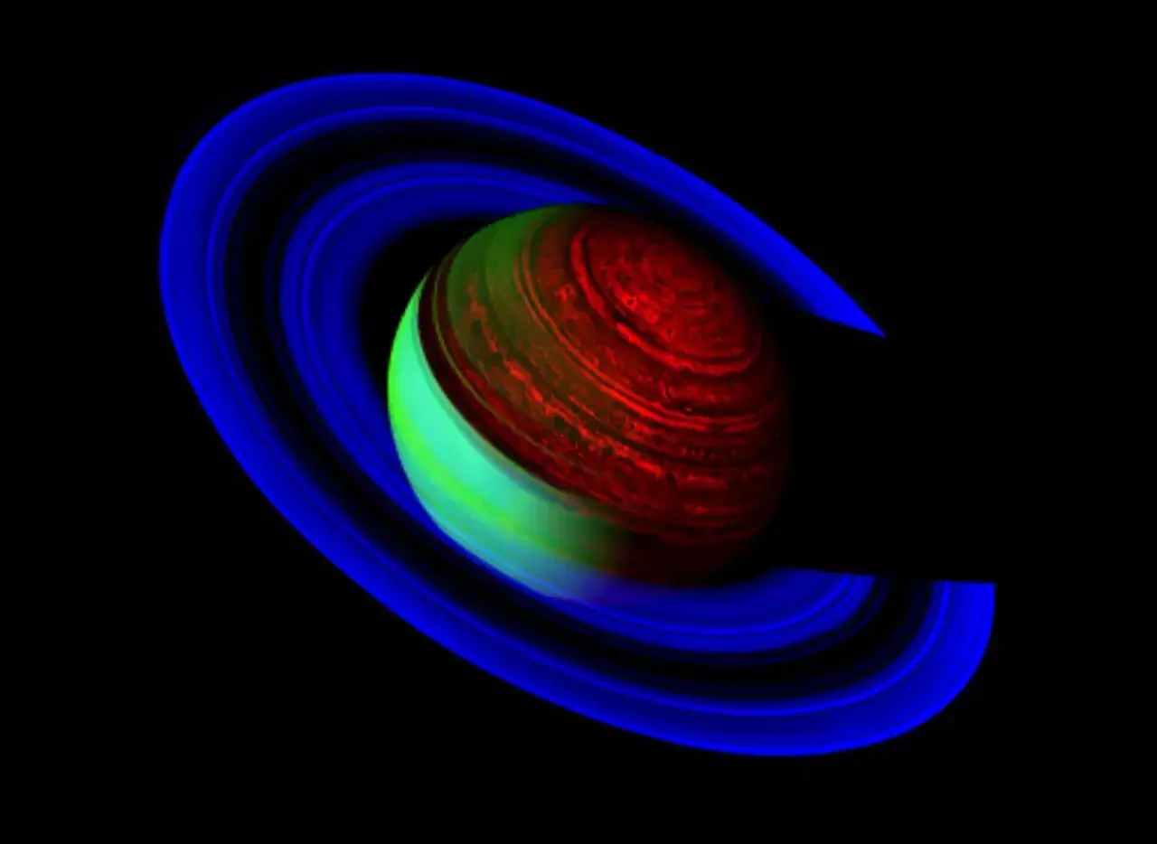 Saturnus ringar i blått omger en planet med rött och grönt som visar saturnus temperatur nattsida.