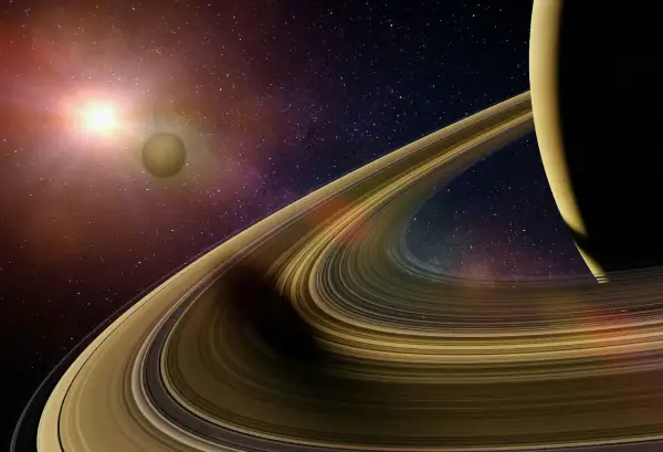Saturnus ringar glittrar i solljuset, en måne svävar i bakgrunden bland stjärnorna.