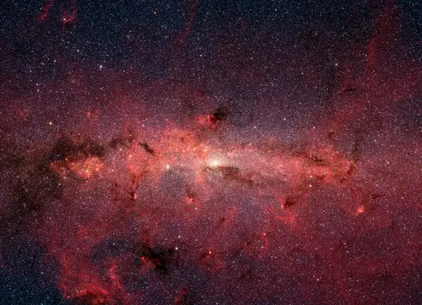 En glödande röd nebulosa fylld av stjärnor, som visar vad universum består av.