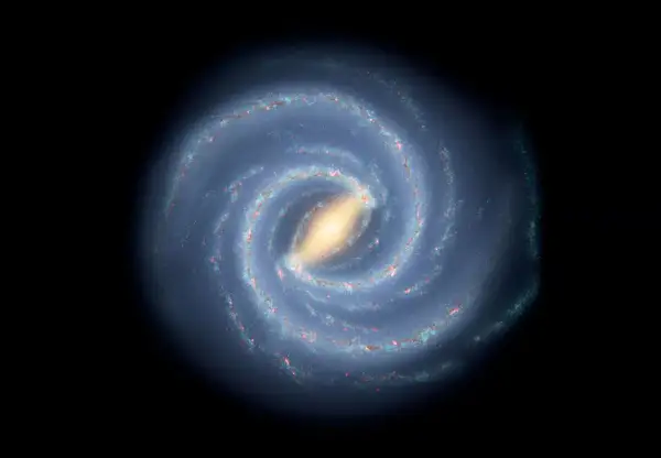 En bild av spiralformade galaxer med en ljusgul kärna och blåa armar fyllda med stjärnor och gas.
